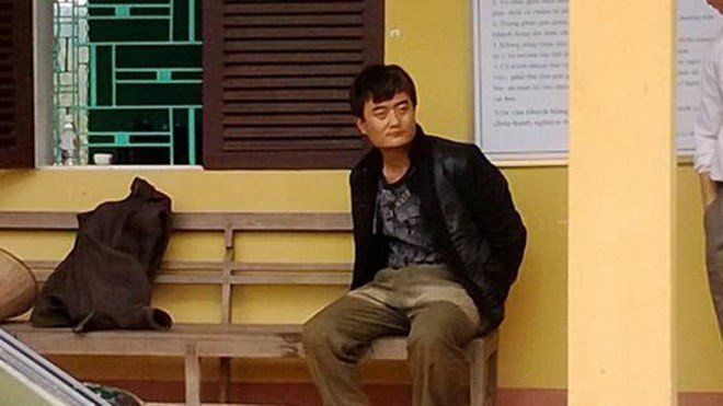 Một trong hai nghi phạm người Trung Quốc bị bắt giữ.