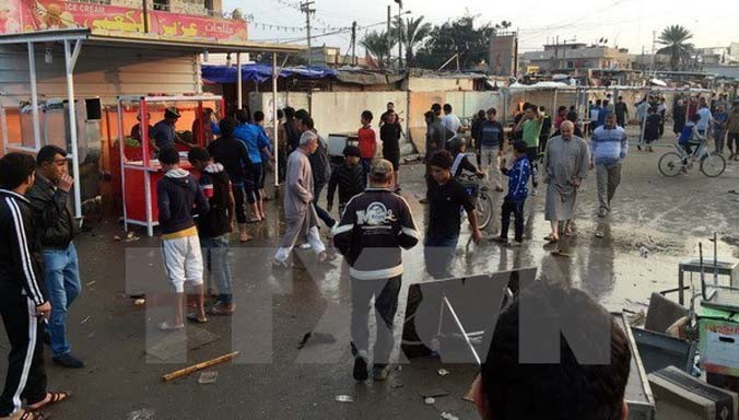 Hiện trường một vụ đánh bom ở Iraq. Nguồn: THX/TTXVN.