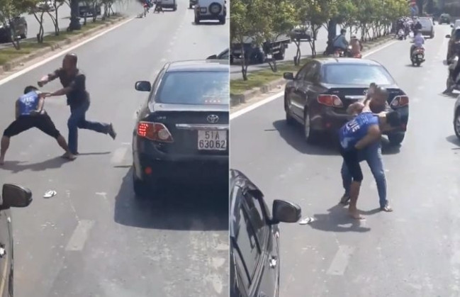 Hai người đàn ông ẩu đả giữa phố. Ảnh cắt từ clip