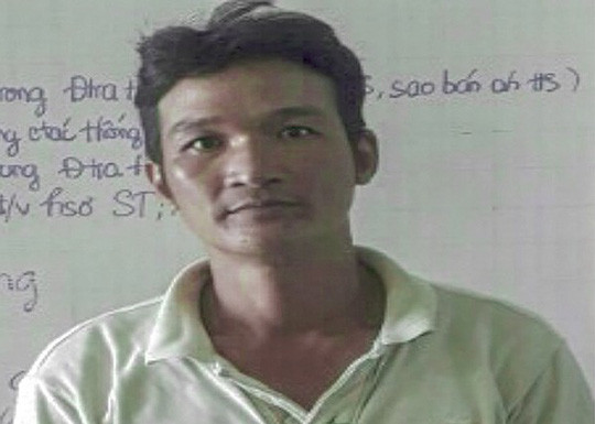 Lê Thanh Phong tại cơ quan công an - Ảnh: Công an cung cấp