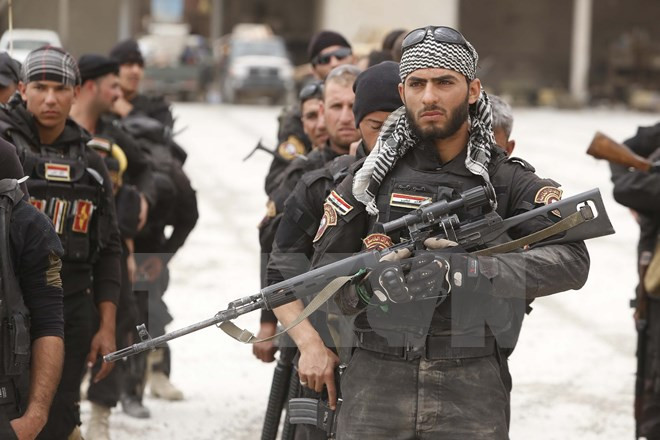 Binh sĩ Iraq tham gia chiến dịch giành lại nhà máy lọc dầu Baiji từ IS. (Nguồn: AFP/TTXVN)
