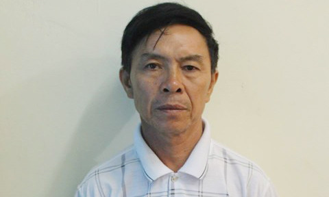 Nghi phạm Nguyễn Hữu Sơn tại cơ quan công an 