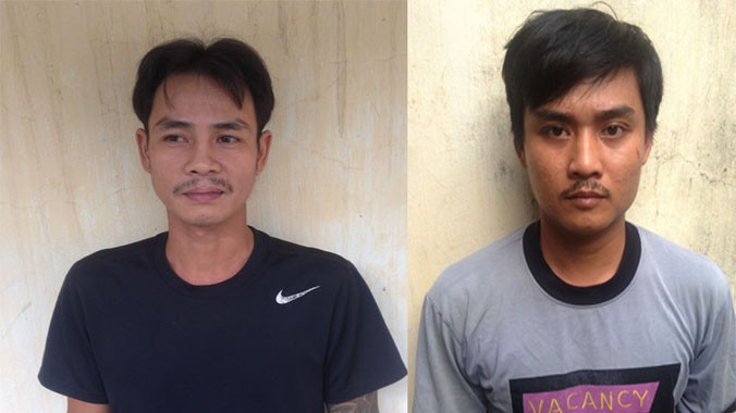 Nghi can Thành (trái) và Thùng tại cơ quan điều tra. Ảnh Việt Văn.