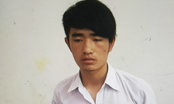 Dũng tại cơ quan công an. Ảnh: Hải Bình