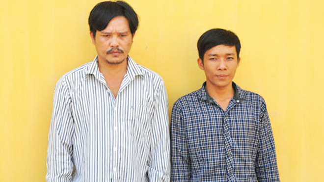 Nghi phạm Huỳnh Văn Thanh và Lê Ngọc Đến tại cơ quan điều tra.