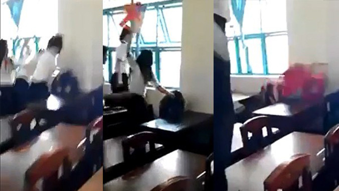 Nữ sinh lớp 7/5 bị đánh hội đồng. Ảnh cắt ra từ clip.