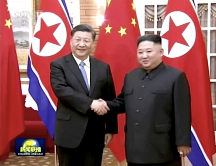 Ông Tập Cận Bình và Ông Kim Jong Un tại cuộc gặp ở Bình Nhưỡng vào tháng 6/2019. (Ảnh: AP)