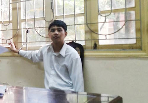 Tuấn tại trụ sở công an. Ảnh: H. Hưng