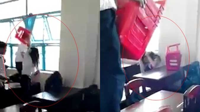 Nữ sinh bị bạn dùng ghế nhựa đánh hội đồng. Ảnh: Chụp màn hình.