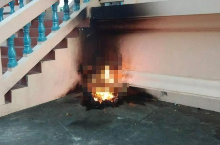 Người đàn ông vào chùa tự thiêu, ôm theo tập vé số và giấy vay nợ ngân hàng.