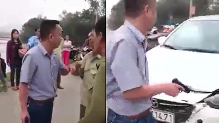 Người đàn ông có hành vi rút súng đe dọa bắn người dân. Ảnh cắt từ clip.