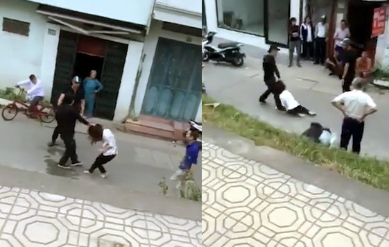 Cô gái bị túm tóc, kéo lê dưới đường. Ảnh cắt từ clip