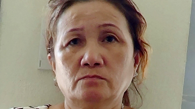 Bà Sương lúc bị bắt. Ảnh: Nguyệt Triều