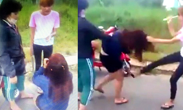 Em G. đang bị 2 thiếu nữ hành hung. Ảnh từ clip