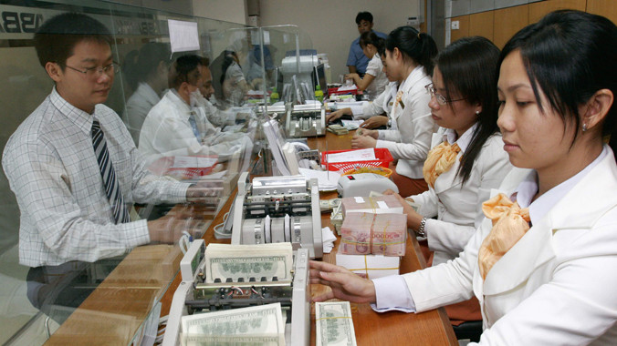 Tỉ giá năm nay sẽ tăng 1 hay 2% ?. Ảnh: Như Ý