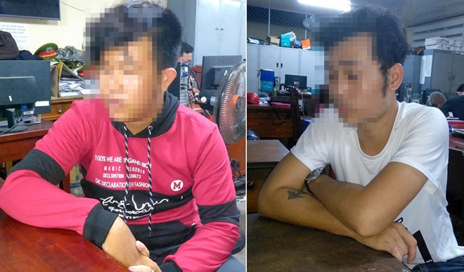 Nguyễn Đức Nhân (áo đỏ) và Lê Thanh H (áo trắng) tại cơ quan Công an.