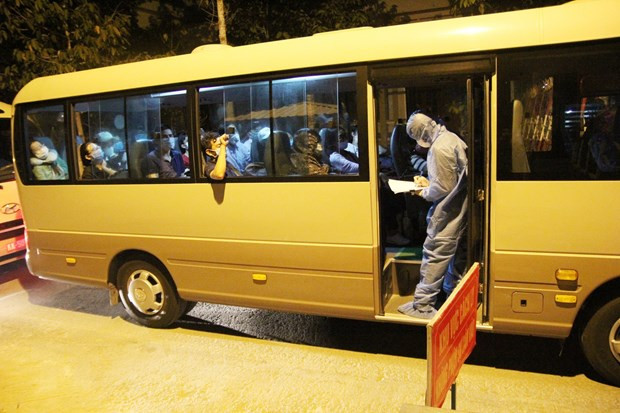 Những công dân từ nước ngoài trở về được cách ly tại khu cách ly Trường Quân sự tỉnh Tiền Giang. (Ảnh: Nam Thái/TTXVN phát)