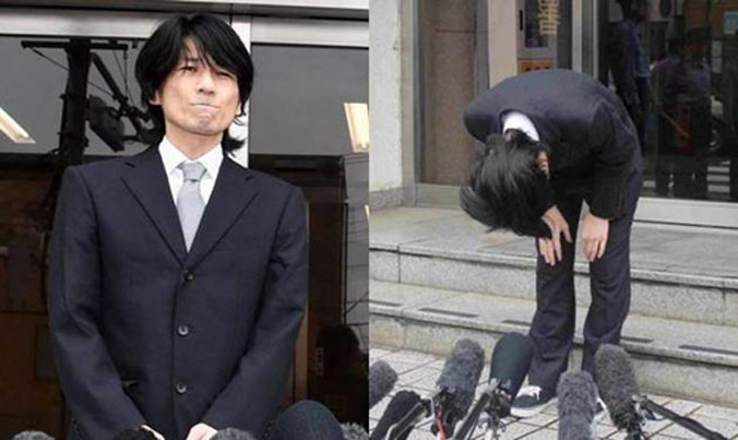 Takahashi Kenichi gập người xin lỗi vì phạm pháp.