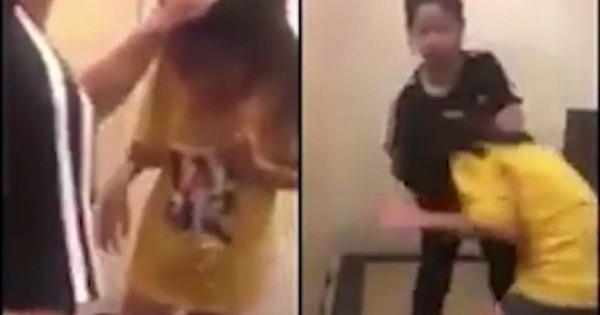 Học sinh lớp 5 bị nhóm nữ sinh lớp 7 đánh hội đồng. Ảnh cắt từ clip