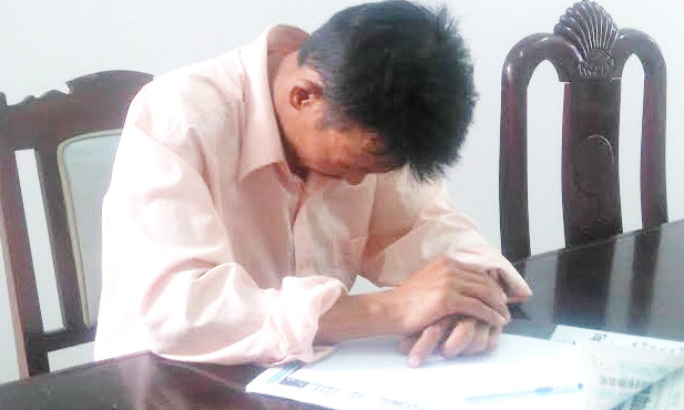 Anh Nguyễn Đình Quang tại cơ quan công an. Ảnh: Nguyên Vũ