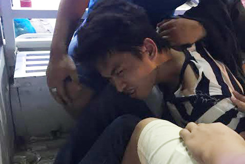 Lộc bị cảnh sát áp giải. Ảnh: C.A