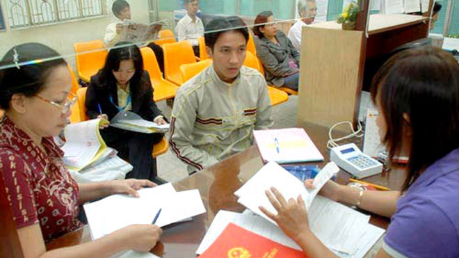 Từ tháng 1/2015 những trường hợp chậm giải quyết sổ đỏ sau 20 ngày sẽ bị coi là vi phạm trong tiếp nhận hồ sơ - Ảnh: Tấn Thanh