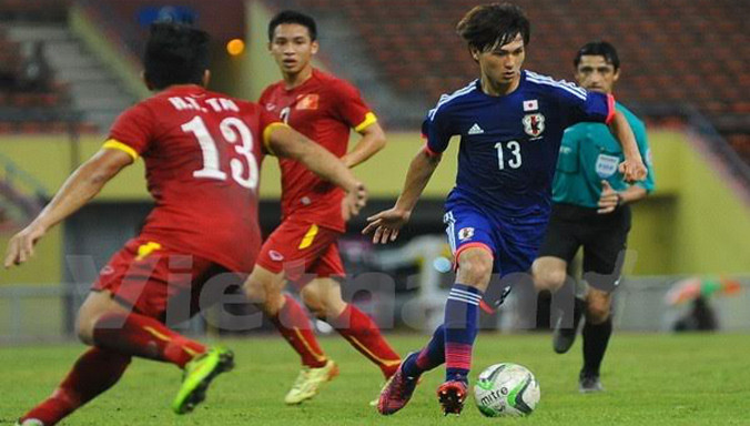 Các cầu thủ U23 Việt Nam (áo đỏ) thua U23 Nhật Bản.