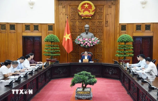 Thủ tướng Phạm Minh Chính chủ trì cuộc họp với ngành ngân hàng về chính sách tiền tệ. (Ảnh: Dương Giang/TTXVN) Thủ tướng Phạm Minh Chính chủ trì cuộc họp với ngành ngân hàng về chính sách tiền tệ. (Ảnh: Dương Giang/TTXVN)