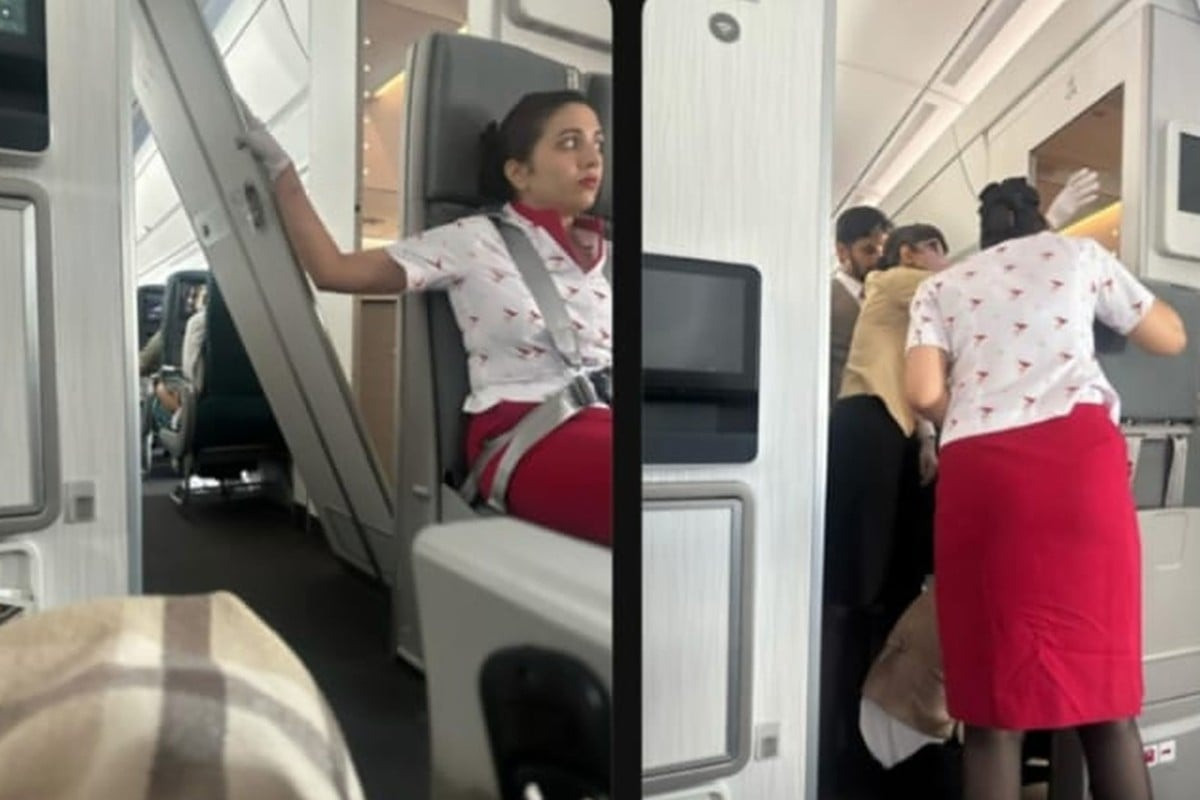 Hình ảnh do hành khách chụp lại cho thấy một nhân viên Cathay Pacific đang giữ cửa. Ảnh: Threads.