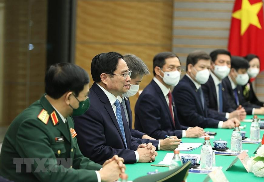 Thủ tướng Phạm Minh Chính và Đoàn đại biểu Việt Nam tại buổi hội đàm. (Ảnh: Dương Giang/TTXVN)