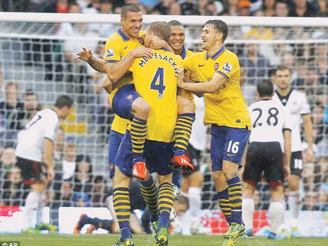 Arsenal có chiến thắng xứng đáng trong cơn mưa tầm tã. Ảnh: ap/gETTY iMAGES. Arsenal có chiến thắng xứng đáng trong cơn mưa tầm tã. Ảnh: ap/gETTY iMAGES