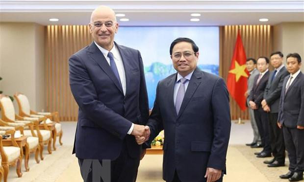 Thủ tướng Phạm Minh Chính tiếp Bộ trưởng Ngoại giao Cộng hòa Hy Lạp Nikolaos Dendias. (Ảnh: Dương Giang/TTXVN).