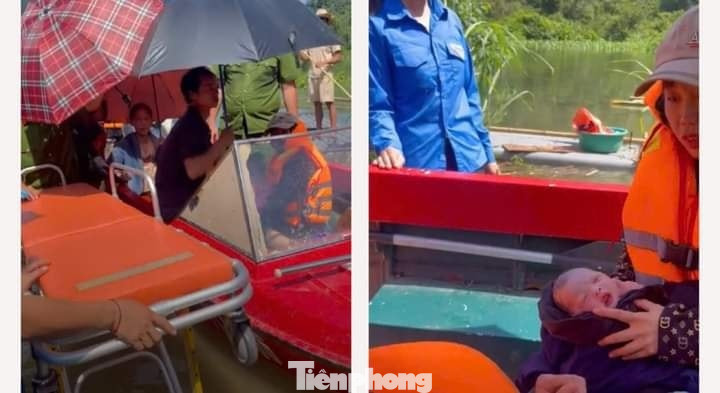 Hình ảnh sản phụ sinh em bé trên xuồng chạy lũ được nhân dân ghi lại.
