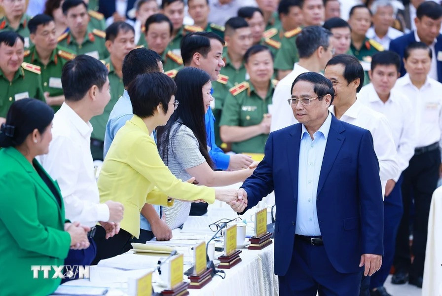 Thủ tướng Phạm Minh Chính với các đại biểu dự Hội nghị đảm bảo an ninh trật tự phục vụ phát triển kinh tế-xã hội các tỉnh Tây Nguyên. Ảnh: Dương Giang/TTXVN.