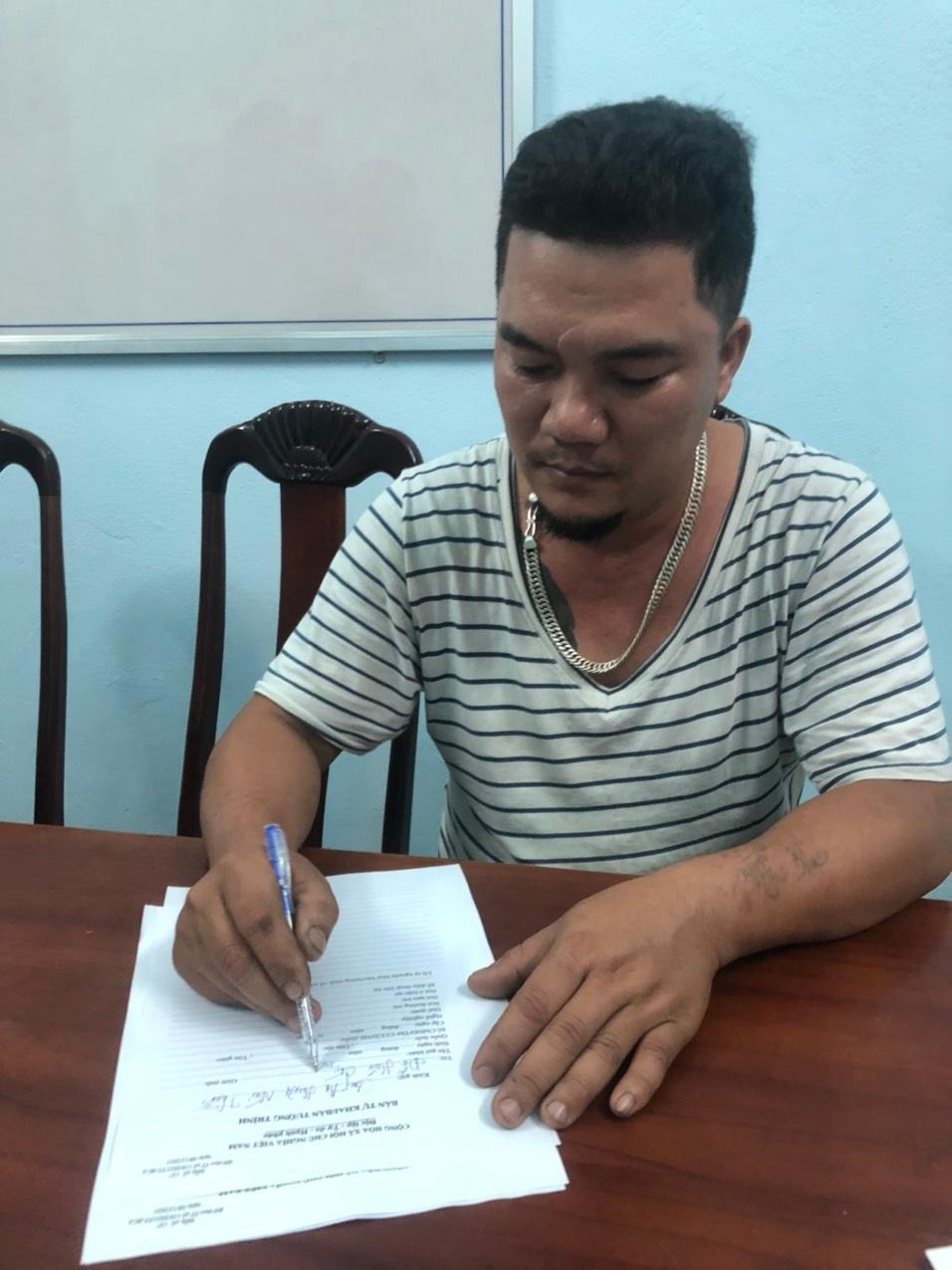 Đỗ Hữu Chí tại cơ quan công an. Ảnh CA