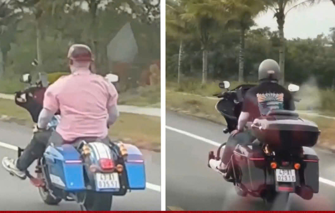 Hình ảnh hai người đàn ông buông cả hai tay khi lái xe mô tô trên đường. Ảnh CA Hình ảnh hai người đàn ông buông cả hai tay khi lái xe mô tô trên đường. Ảnh CA
