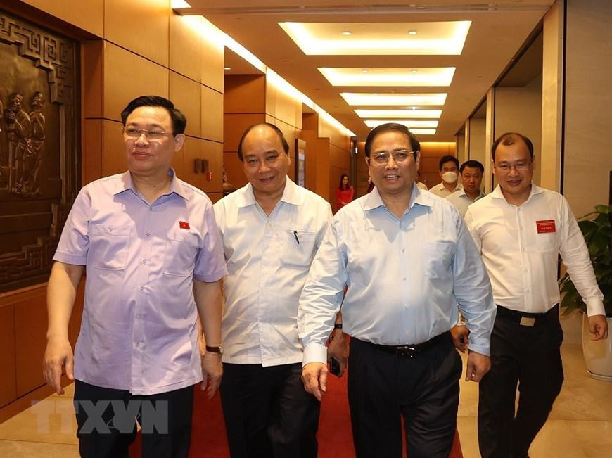 Chủ tịch nước Nguyễn Xuân Phúc, Thủ tướng Phạm Minh Chính, Chủ tịch Quốc hội Vương Đình Huệ đến dự hội nghị. (Ảnh: Trí Dũng/TTXVN) Chủ tịch nước Nguyễn Xuân Phúc, Thủ tướng Phạm Minh Chính, Chủ tịch Quốc hội Vương Đình Huệ đến dự hội nghị. (Ảnh: Trí Dũng/TTXVN)