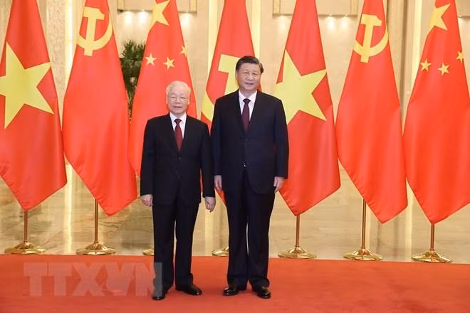 Tổng Bí thư, Chủ tịch nước Trung Quốc Tập Cận Bình đón Tổng Bí thư Nguyễn Phú Trọng. (Ảnh: Trí Dũng/TTXVN)