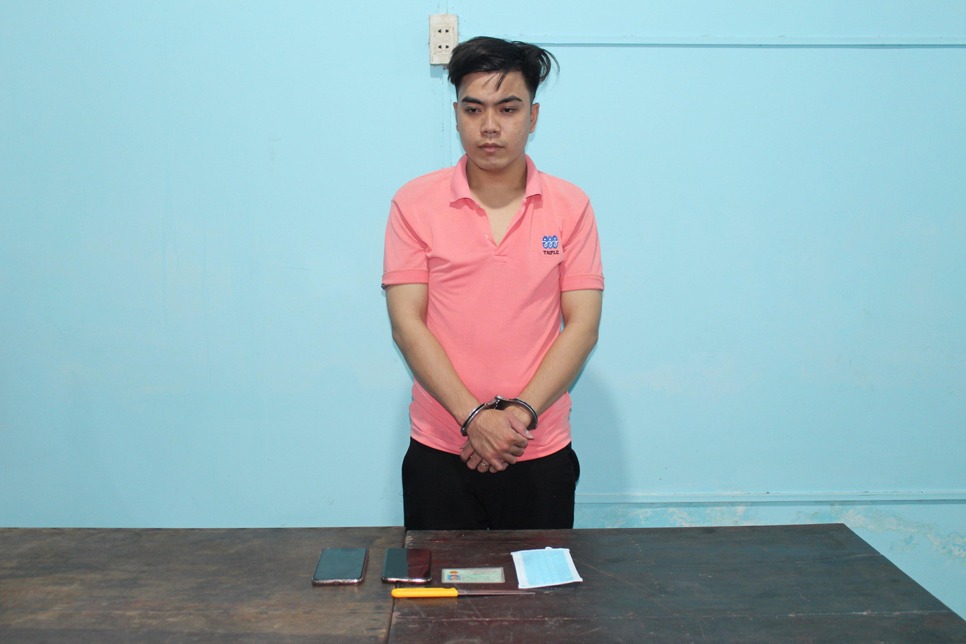 Phan Tấn Đạt tại cơ quan công an.