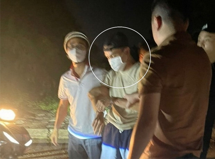 Đối tượng Nguyễn Đức Trung bị bắt giữ. Ảnh: TTXVN phát