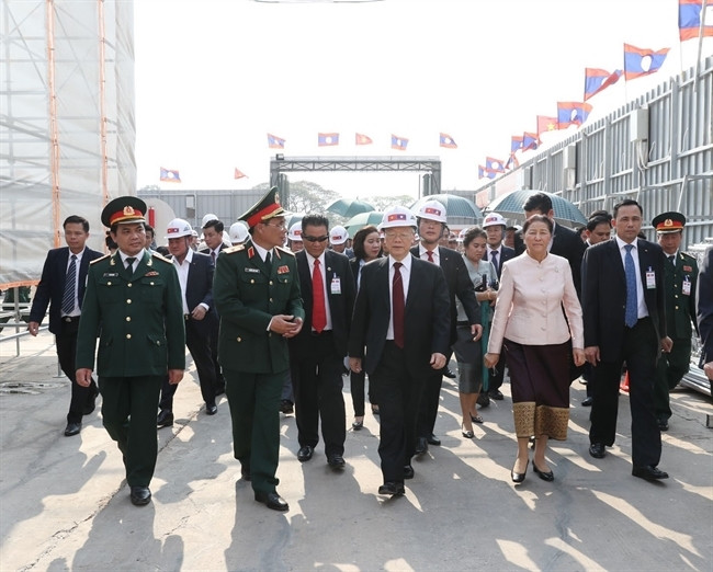 Tổng Bí thư, Chủ tịch nước Nguyễn Phú Trọng, Chủ tịch Quốc hội Lào Pany Yathotou và các đại biểu đến thăm dự án xây dựng Nhà Quốc hội Lào trong chuyến thăm hữu nghị chính thức Lào, tháng 2/2019. (Ảnh: TTXVN)