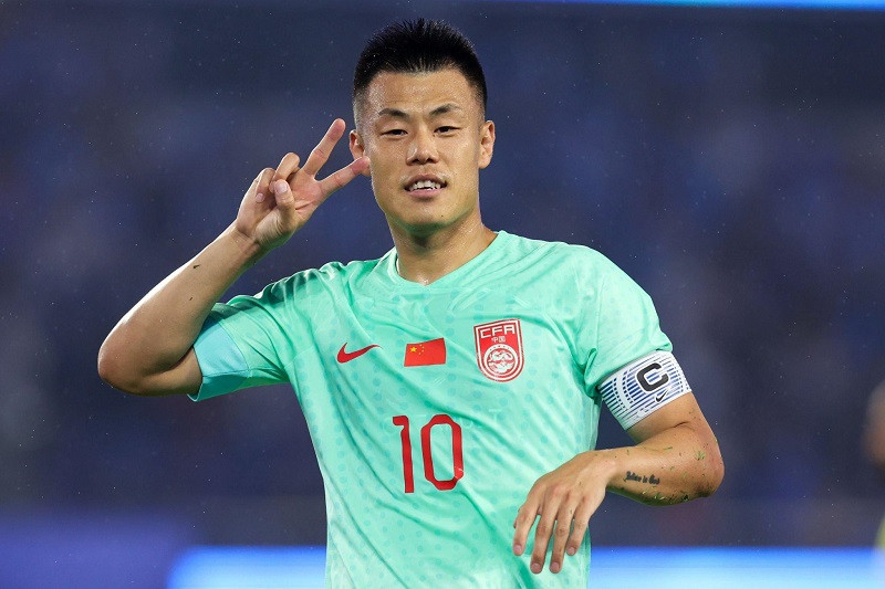 Tan Long ăn mừng cú đúp trước Olympic Myanmar. Ảnh: Getty