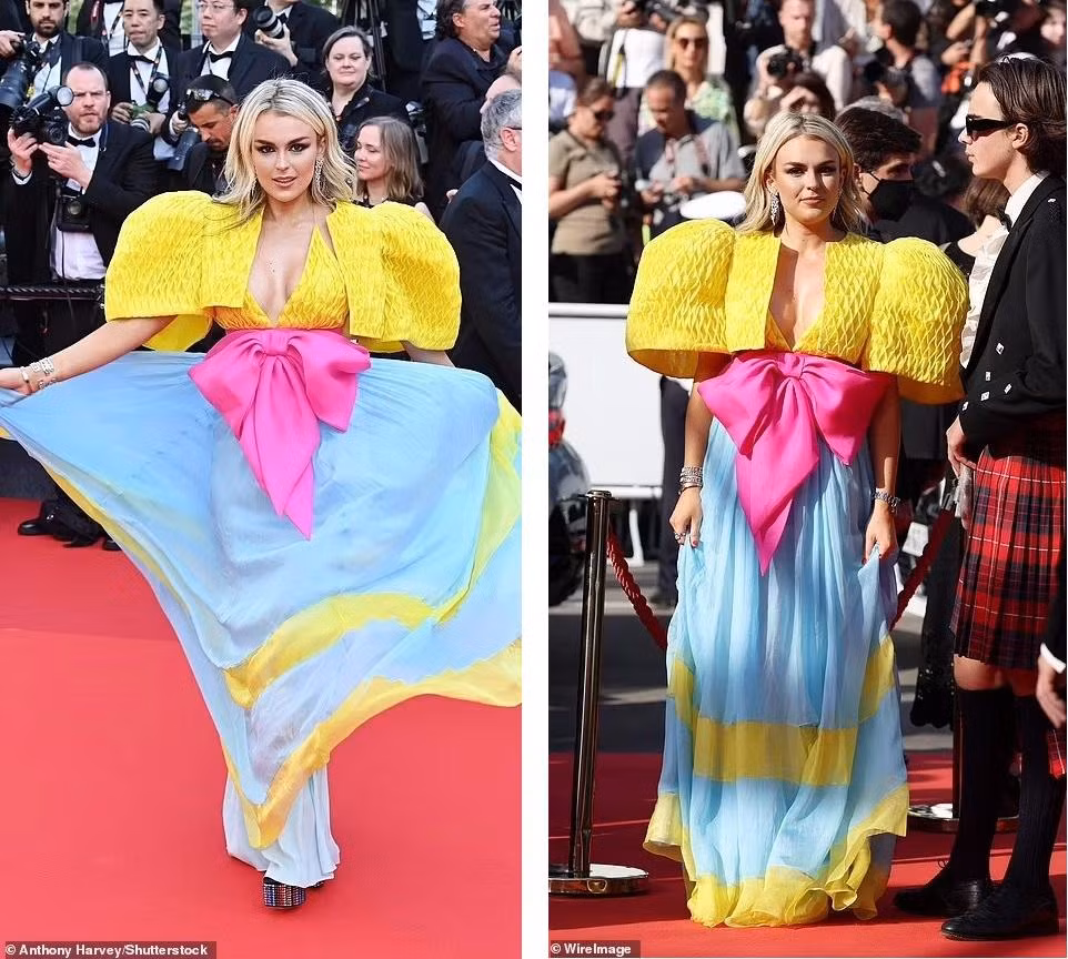 Ca sĩ người Anh Tallia Storm tự tin xoay người trên thảm đỏ với bộ đầm nhiều màu sắc và thiết kế lạ mắt.
