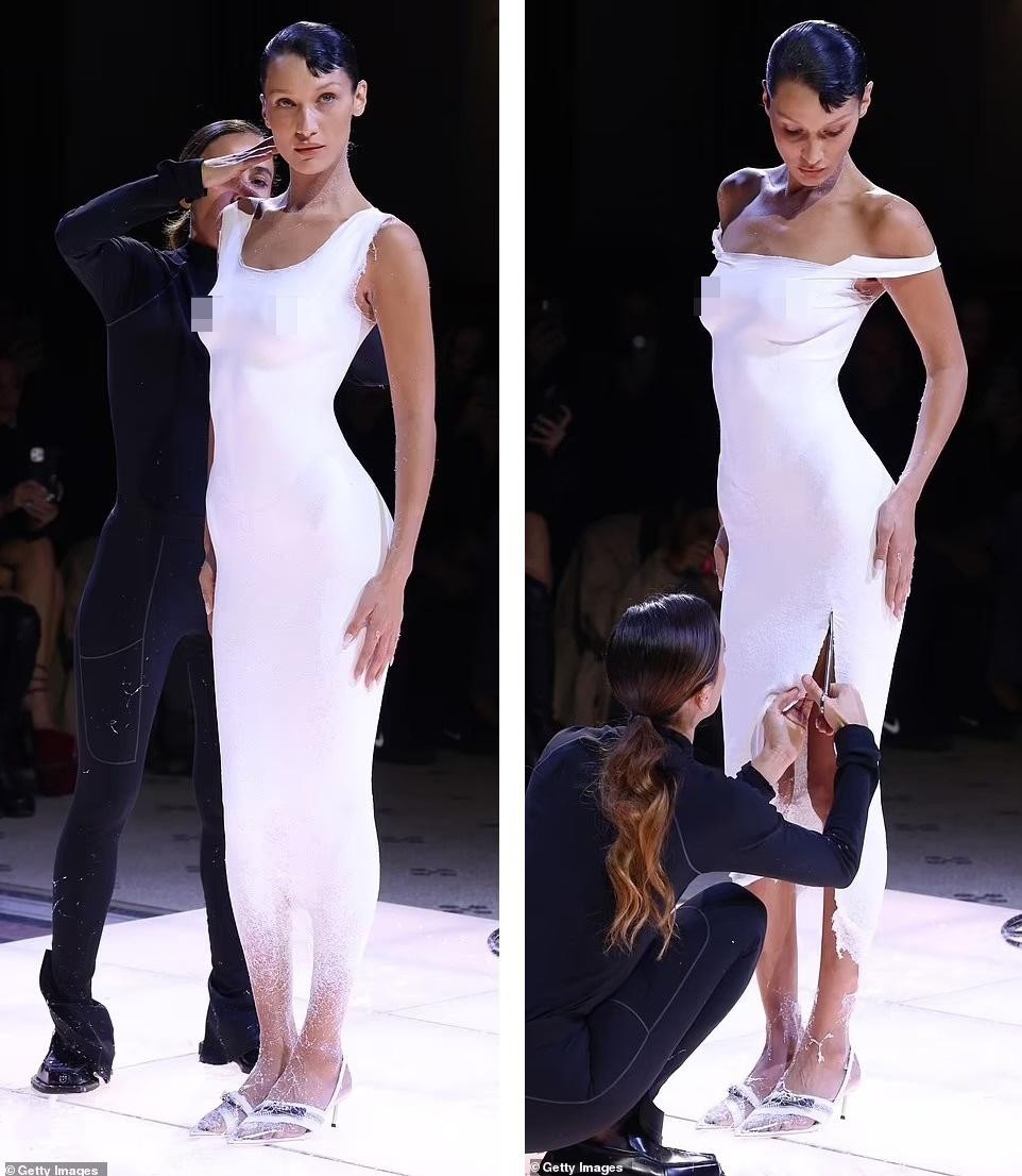 Cuối cùng, nữ nhân viên dùng kéo tạo đường xẻ cao đến đùi. Ảnh: Getty Images.