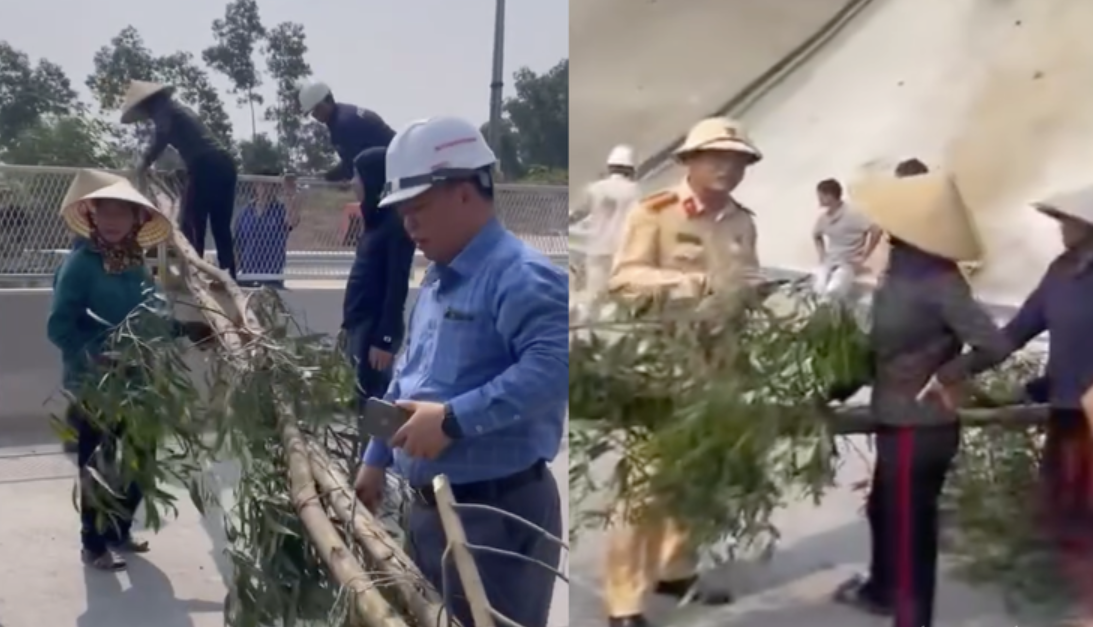 Người dân mang cây ra chặn đường cao tốc Diễn Châu - Bãi Vọt sáng 26/4.