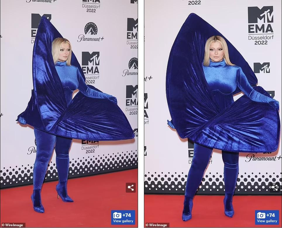 Nữ ca sĩ Behe Rexha mặc trang phục xanh từ cổ đến chân với thiết kế kỳ quái. Ảnh: Wire Image.