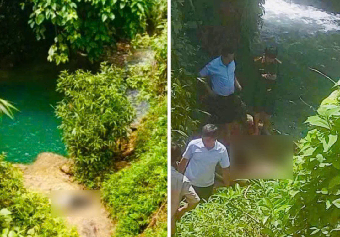 Lực lượng chức năng và người dân đưa thi thể 2 nạn nhân lên bờ.