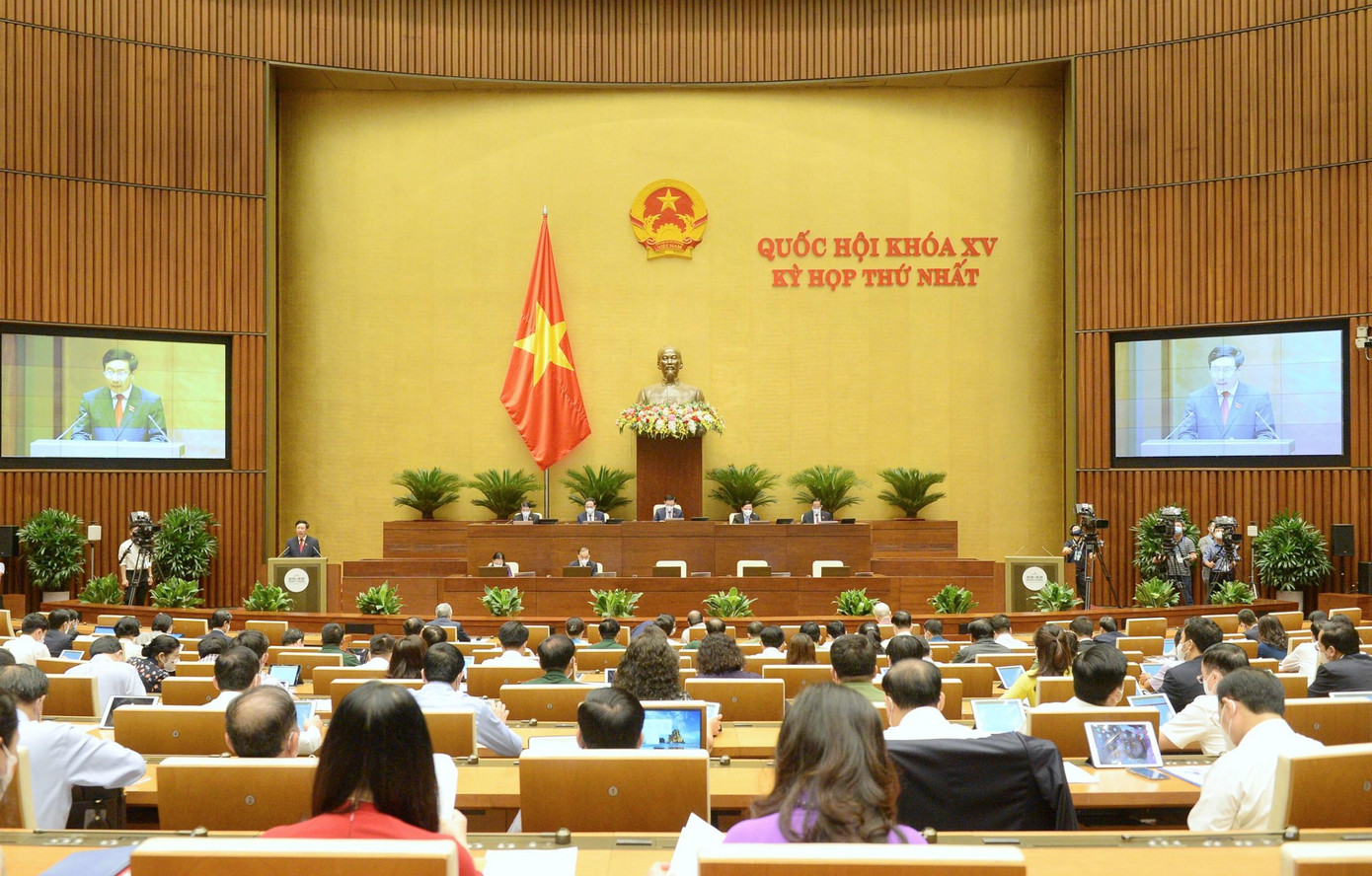 Quốc hội nghe báo cáo về kinh tế - xã hội. Ảnh Như ý