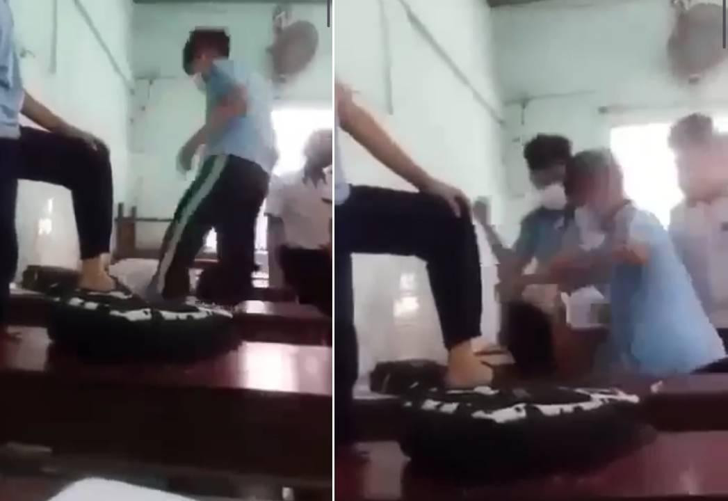 Nhóm học sinh xông vào lớp học vào giờ giải lao rồi lao vào đấm đá bạn học chung trường một cách dã man. (Ảnh chụp từ Video Clip) Nhóm học sinh xông vào lớp học vào giờ giải lao rồi lao vào đấm đá bạn học chung trường một cách dã man. (Ảnh chụp từ Video Clip)