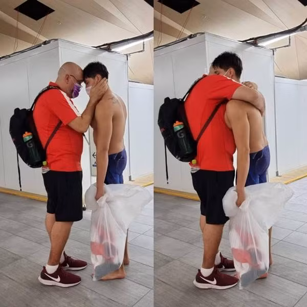 Hình ảnh HLV ôm Schooling để an ủi khiến nhiều người xúc động. Ảnh: Instagram. Hình ảnh HLV ôm Schooling để an ủi khiến nhiều người xúc động. Ảnh: Instagram.